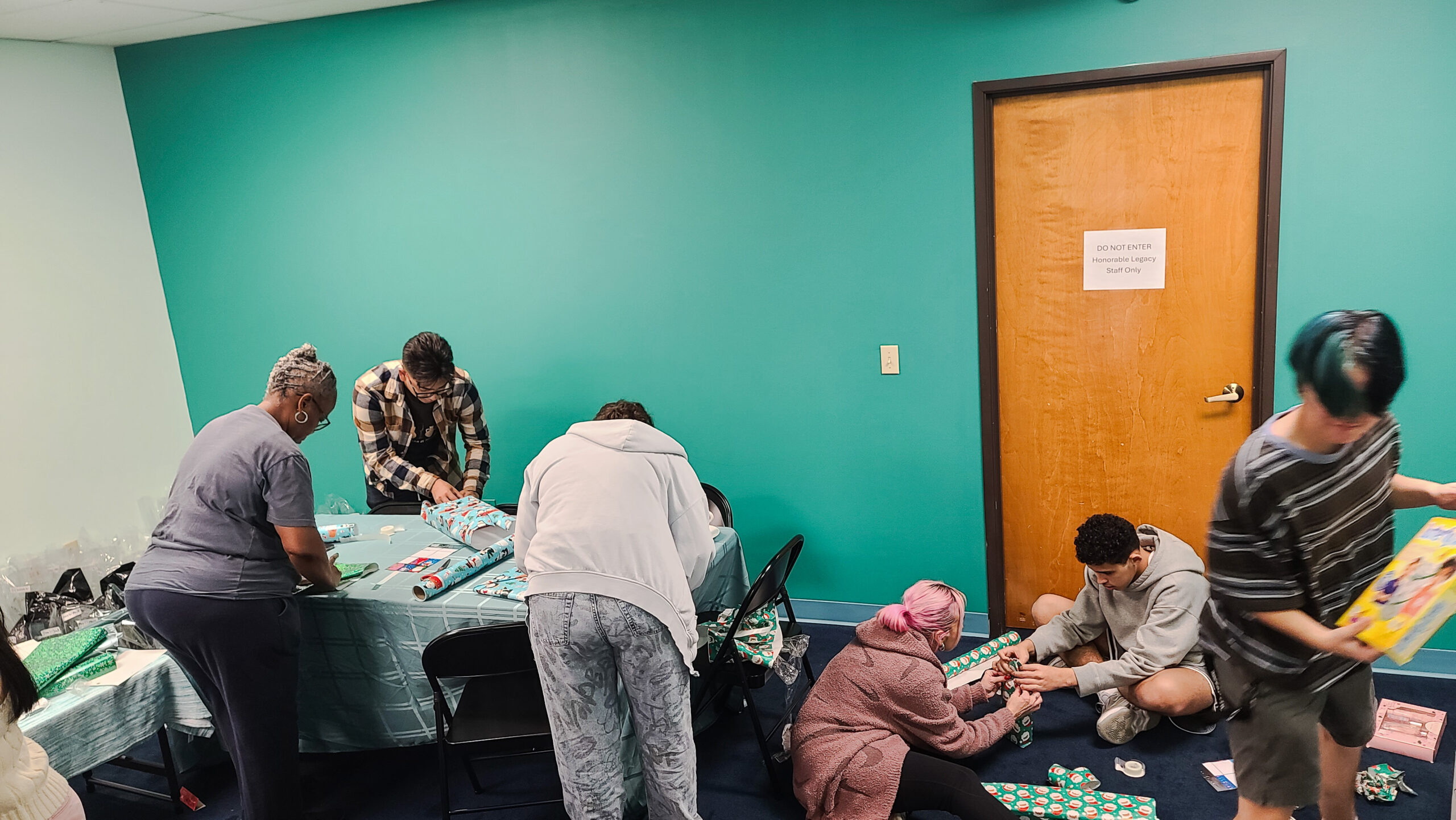 Home Volunteers Wrapping Gifts